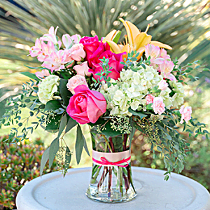100% LOCAL-FLORIST<br>ARRANGED AND DELIVERED