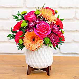 100% Local Florist<br>Arranged and Delivered