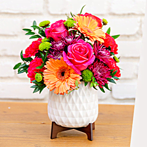 100% Local Florist<br>Arranged and Delivered