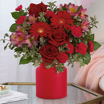 100% LOCAL-FLORIST<br>ARRANGED AND DELIVERED