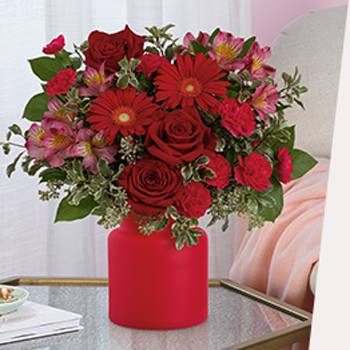 100% LOCAL-FLORIST<br>ARRANGED AND DELIVERED