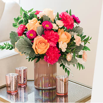 100% LOCAL-FLORIST<br>ARRANGED AND DELIVERED