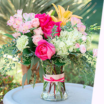 100% LOCAL-FLORIST<br>ARRANGED AND DELIVERED