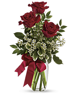 Three Red Roses, White Waxflower, Huckleberry With A Red Ribbon In A Clear Glass Vase. Teleflora Thoughts Of You Bouquet.